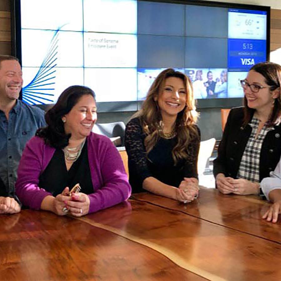 Visa employees with guest speaker