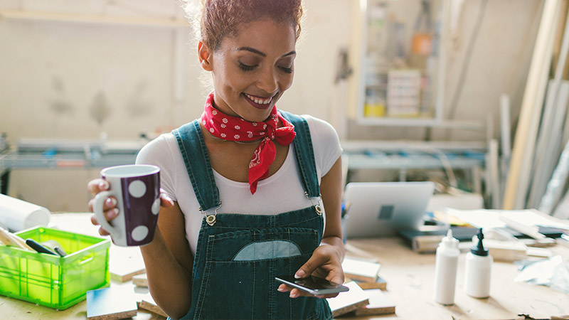 Business woman looking at her phone
